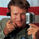 Robbin Williams as Adrian Cronauer in Good Morning, Vietnam