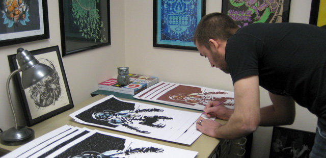 Ryan Lynn signing one of his Prints