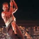 McClane hanging from a fire hose - Die Hard